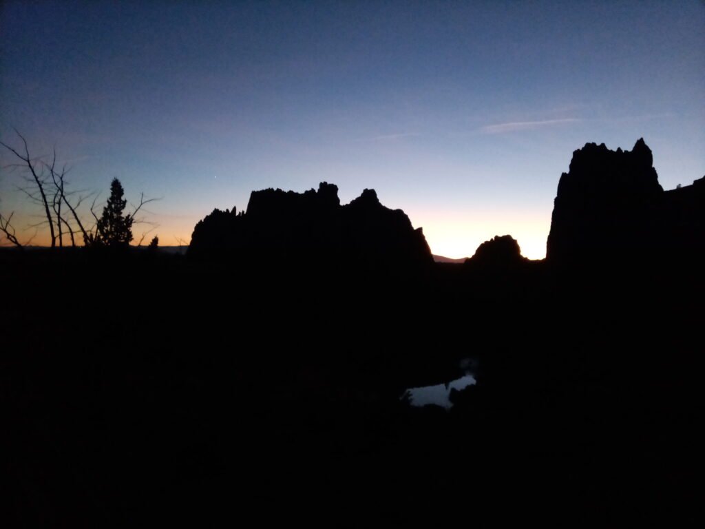 Mongolian desert Silhouette of Mongolian mountains with sunset in the background